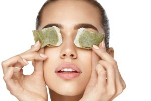 K-beauty remedies for dark circles-woman-tea bags